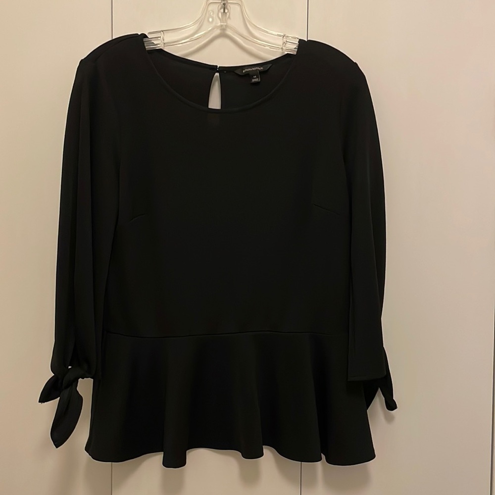 Black top with ruffles and tie sleeves